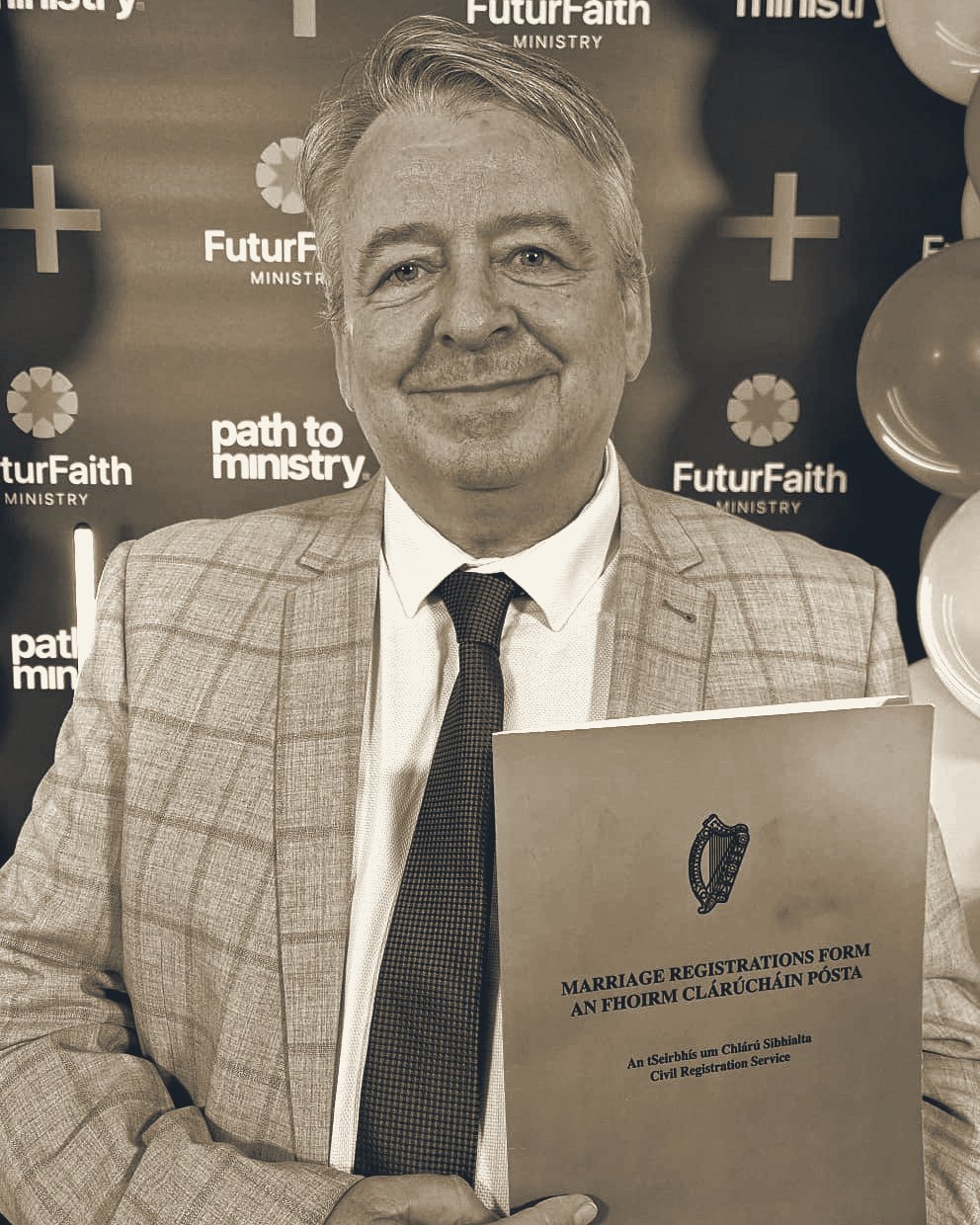 Anthony Brophy at his FuturFaith Ministry registration, holding a Marriage Registration Form