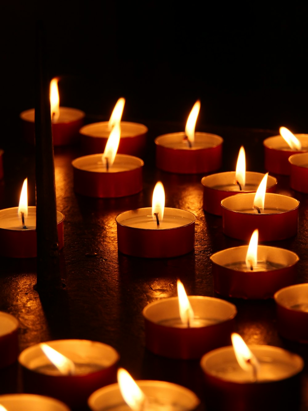 A cluster of lit candles glowing warmly